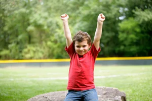 A child celebrating during a sports session